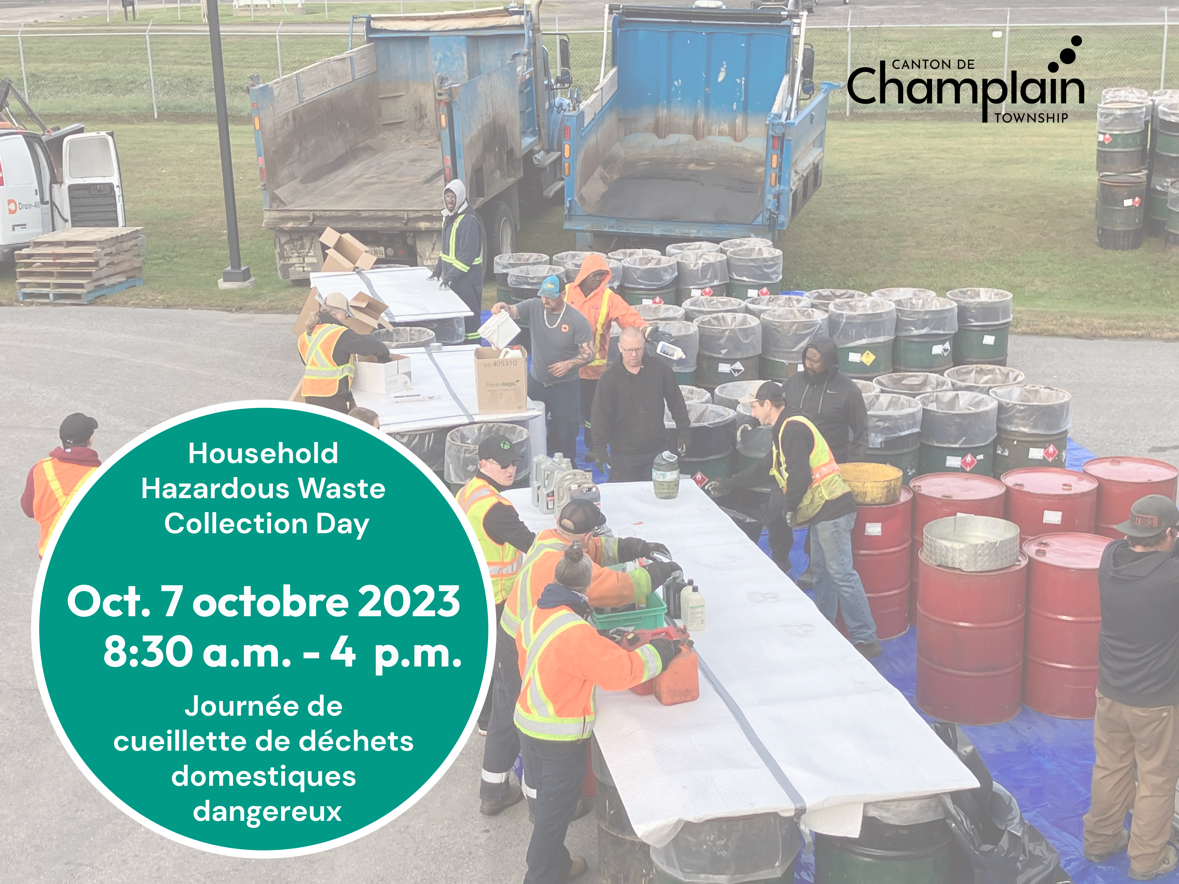 People at sewage plant accepting waste, barrels and trucks in background