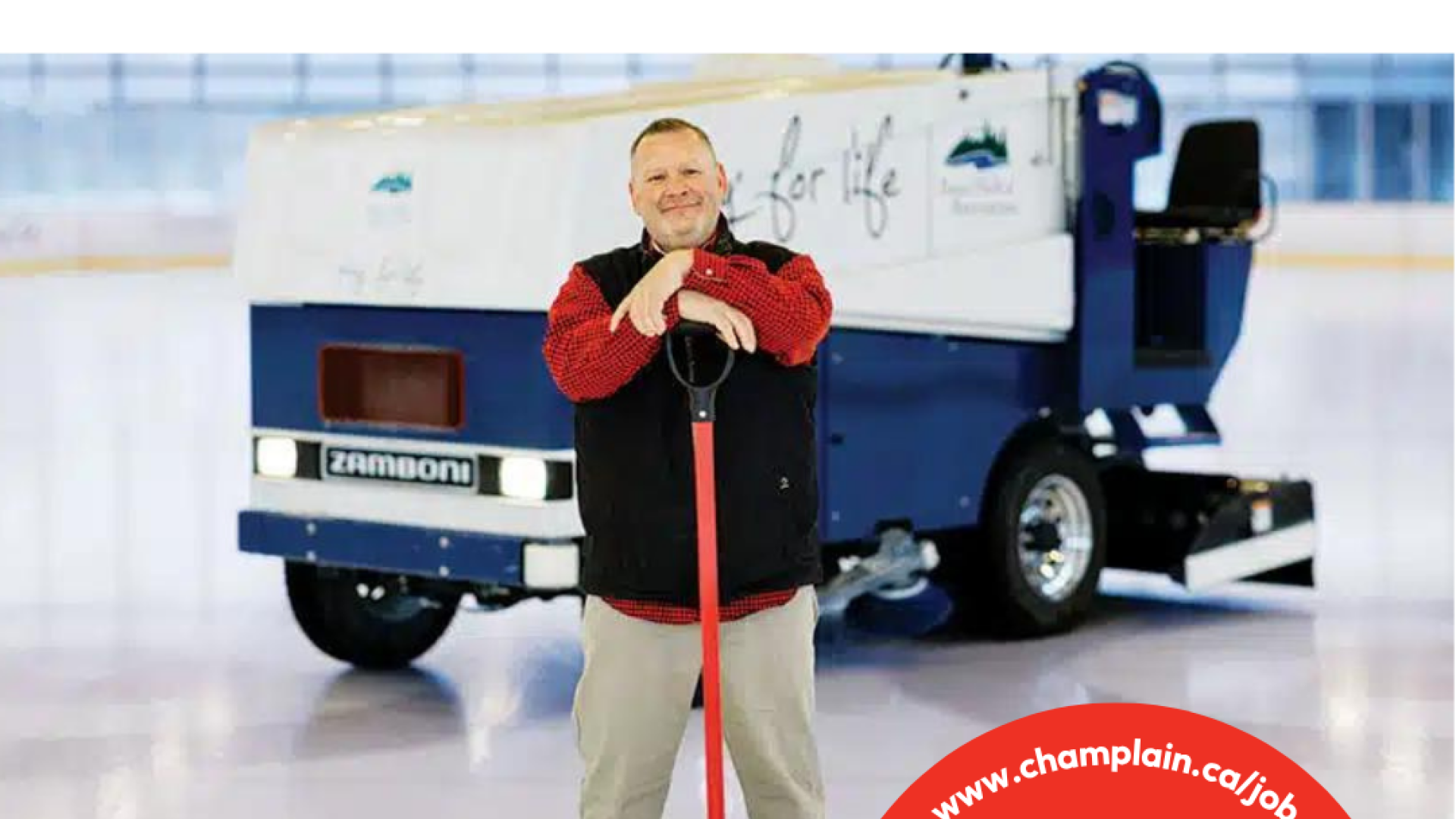 Person with ice resurfacer, holding a snow pusher, on an ice rink.