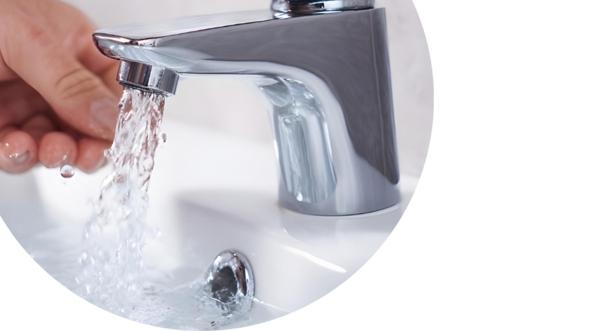 hand washing under a running faucet
