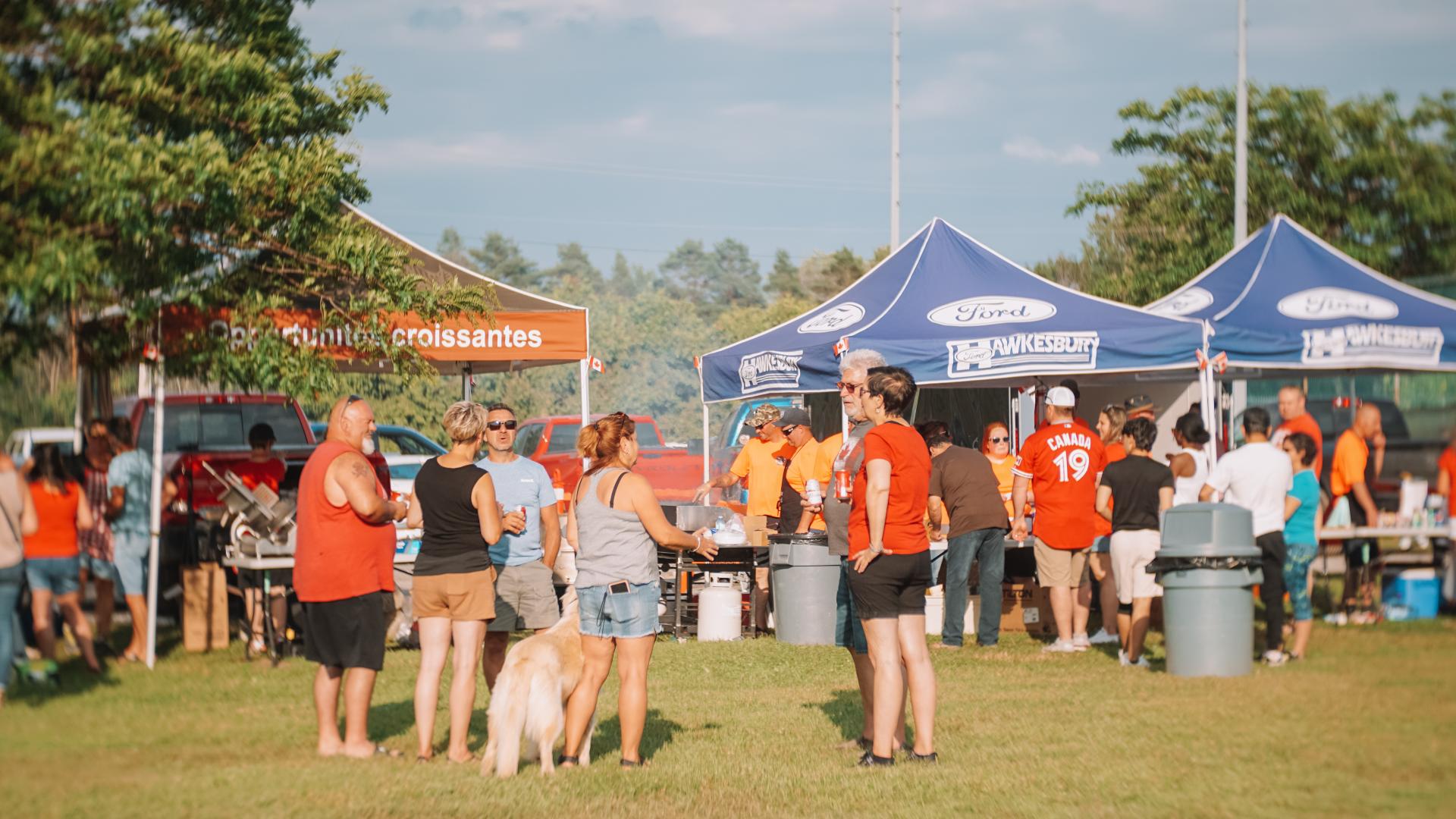 Food vendors and community members gathered at the Canada Day celebration site.