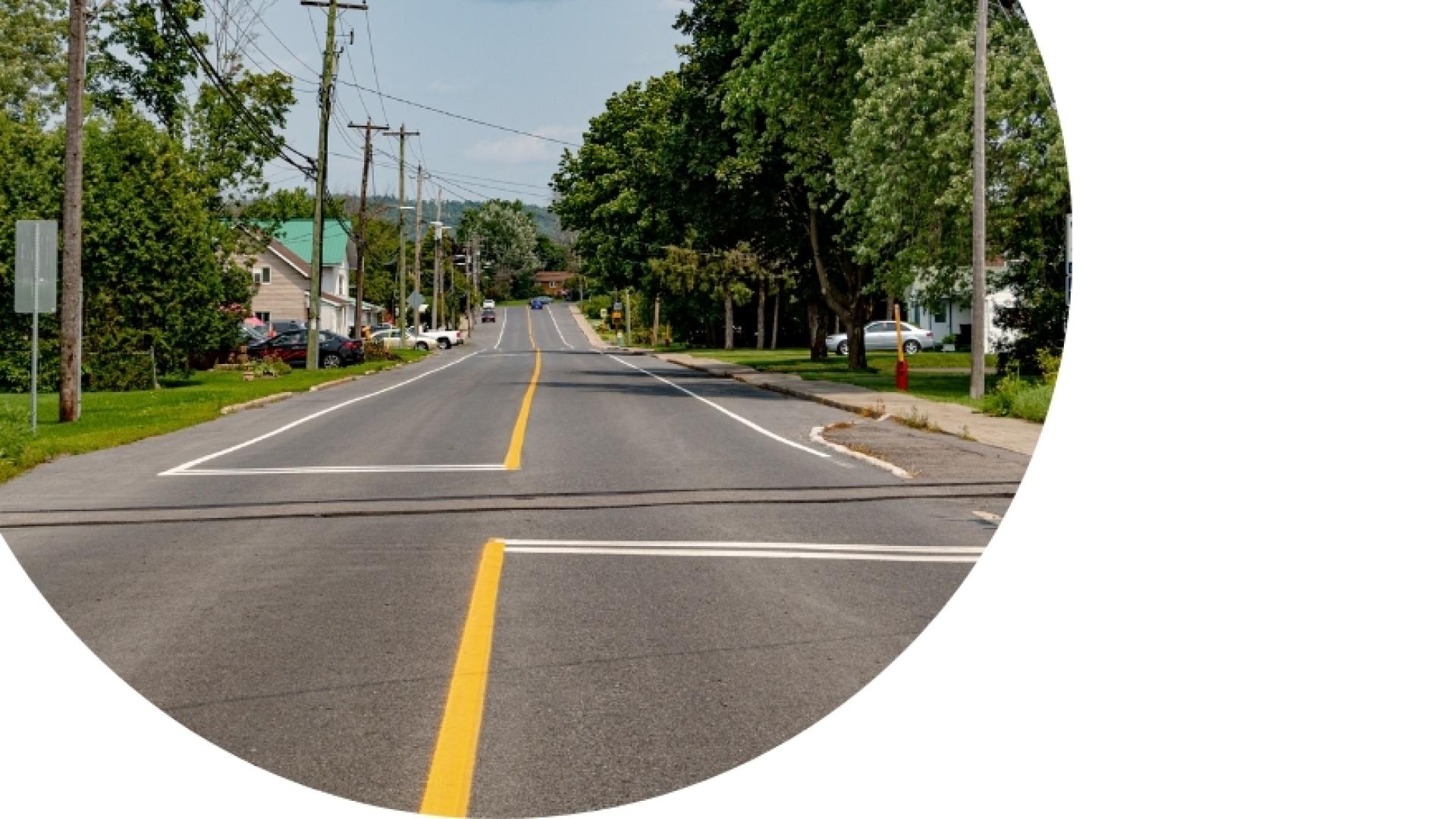 long view of Longueuil Street, crossing a train track
