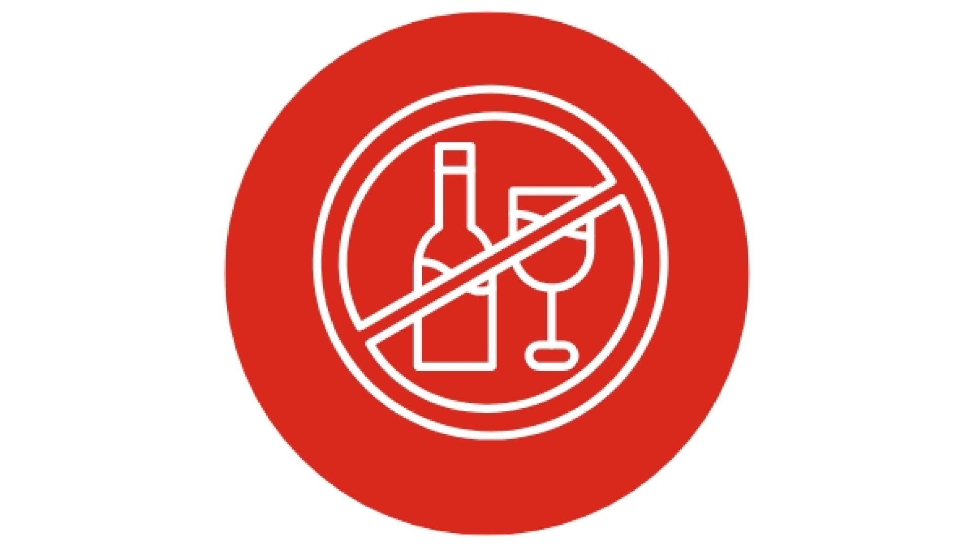 Red safety icon showing a bottle and wine glass crossed out, indicating that alcohol is not permitted.