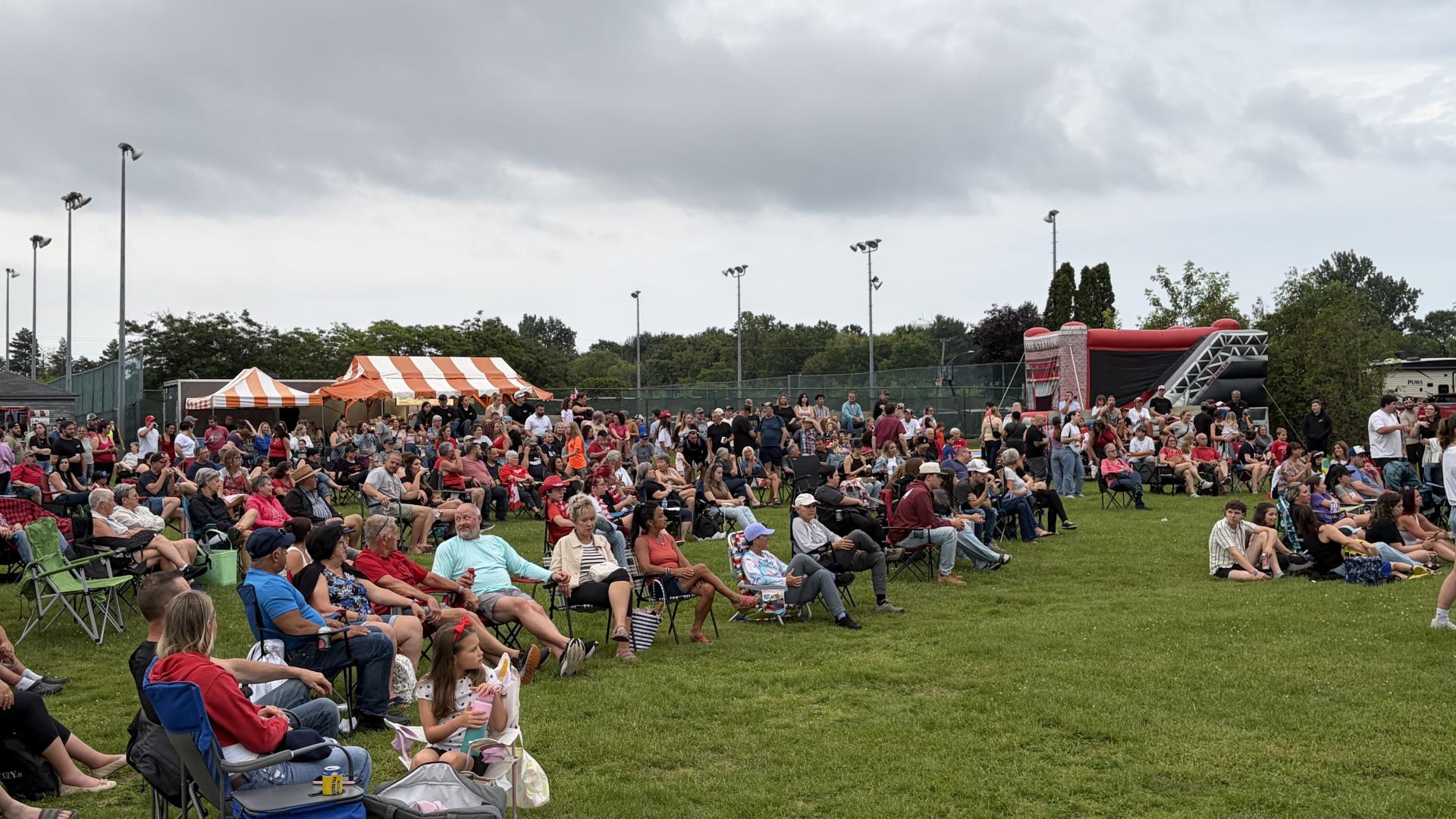 Crowd gathered to watch a live outdoor concert during the Canada Day celebrations.