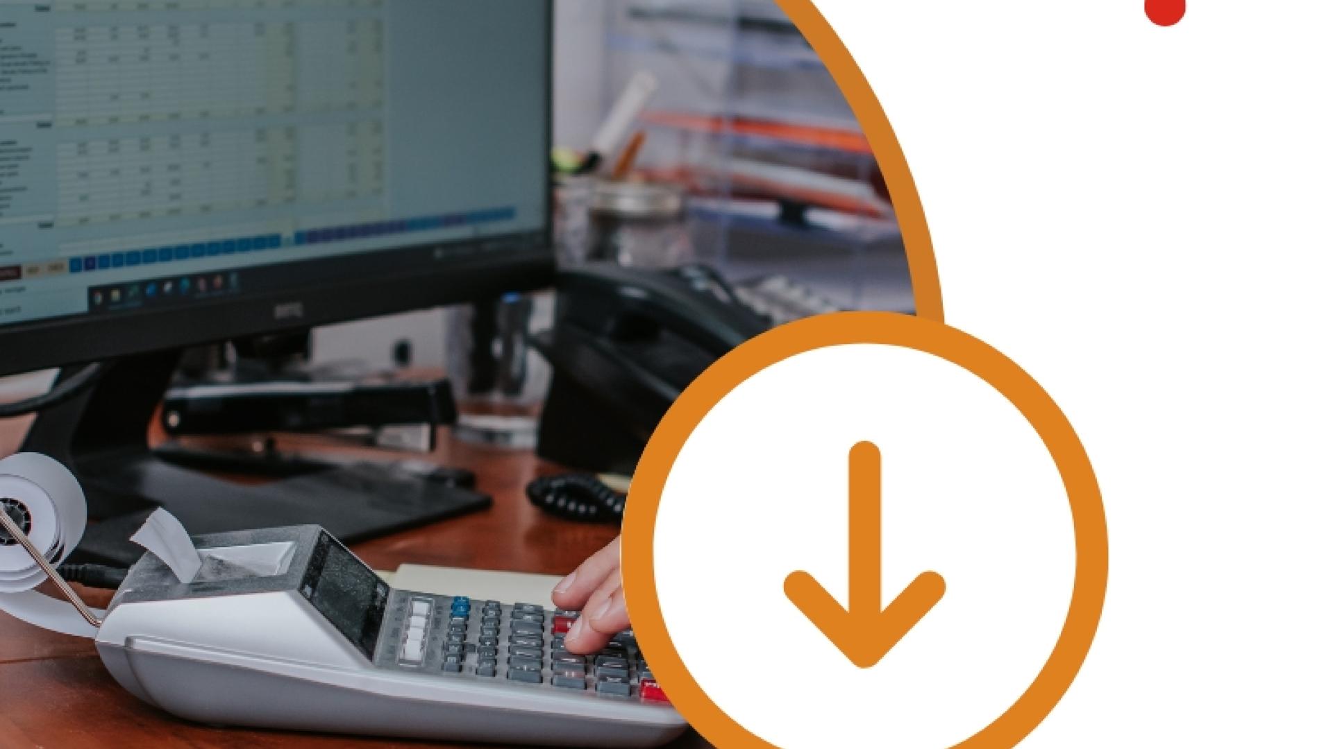 Computer workstation displaying financial software, with a calculator and office desk accessories