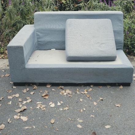 broken couch on the curb for bulky item collection