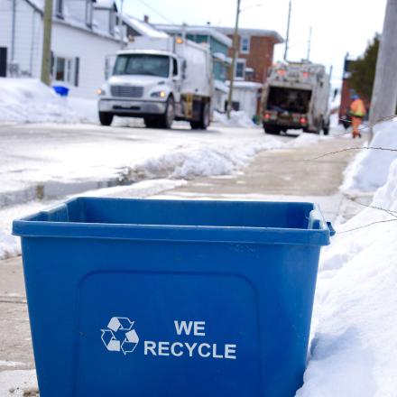 recyling bin on the sidewalk 