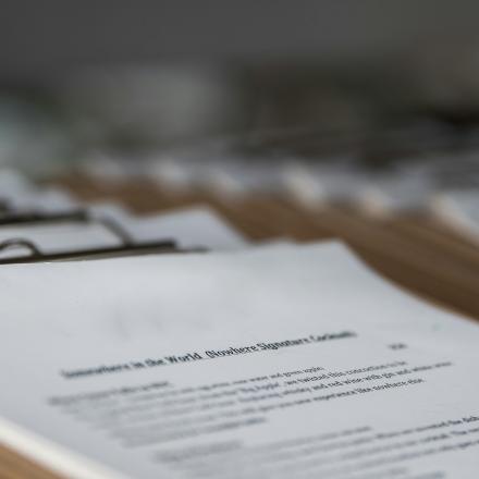 pile of documents on clipboards