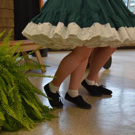 2 persons legs with a ribbon dress dancing