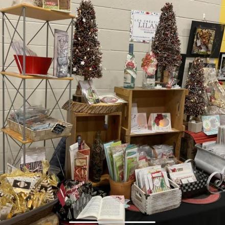 bunch of christmas stuff to sell on a table during a market