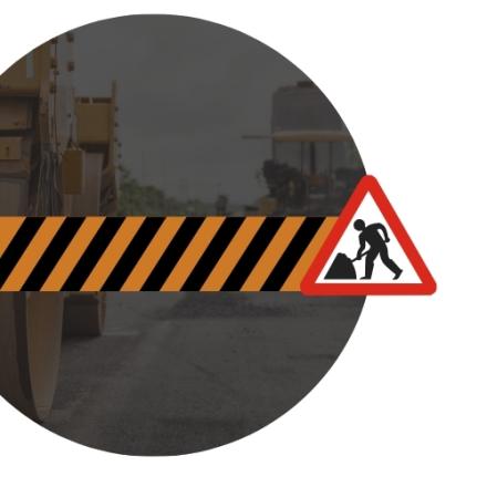 Road construction graphic featuring black and orange hazard stripes with a roadwork warning sign over a faded background of heavy construction equipment.