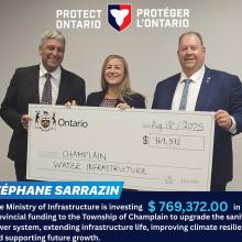 Three people smiling, holding a large cheque for Champlain Water Infrastructure.