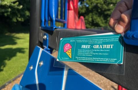 Playground equipment with a turquoise ice cream advert reading "Free".