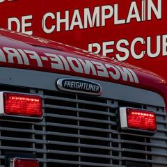 Red fire truck front with "INCENDIE" visible.