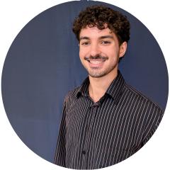 portrait of a young men on a black backdrop