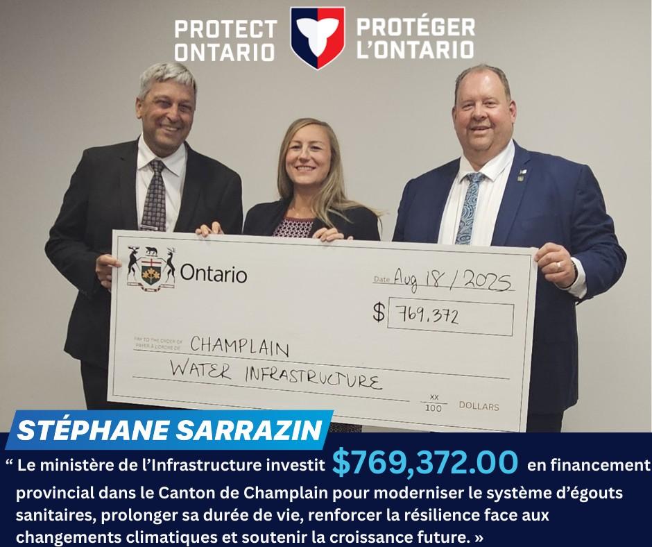 Three people smiling, holding a large Ontario cheque for $769,372.